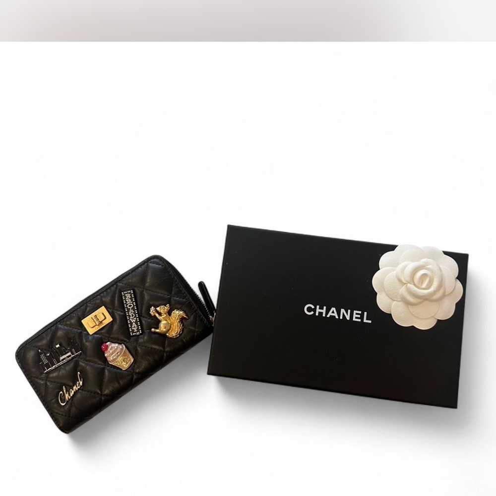 CHANEL Aged Calfskin Quilted Wallet with New York charms